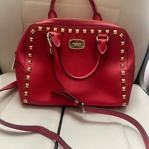 Authentic Michael Kors Crossbody studded purse. No flaws. Like new.